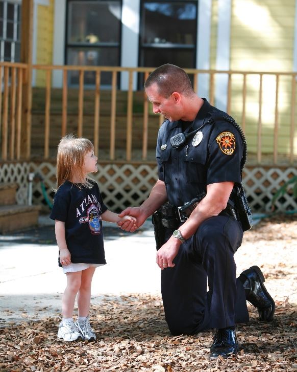 Officer with young child